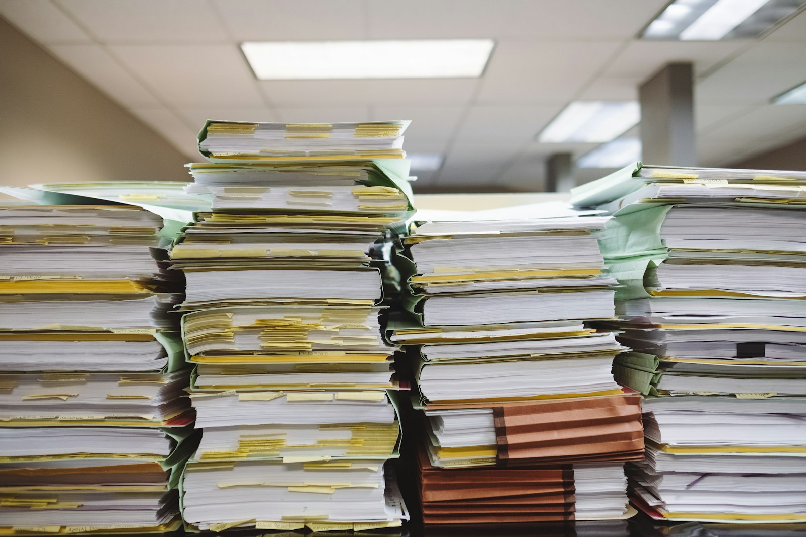 Documents needed for a Pennsylvania car title transfer laid out on a desk