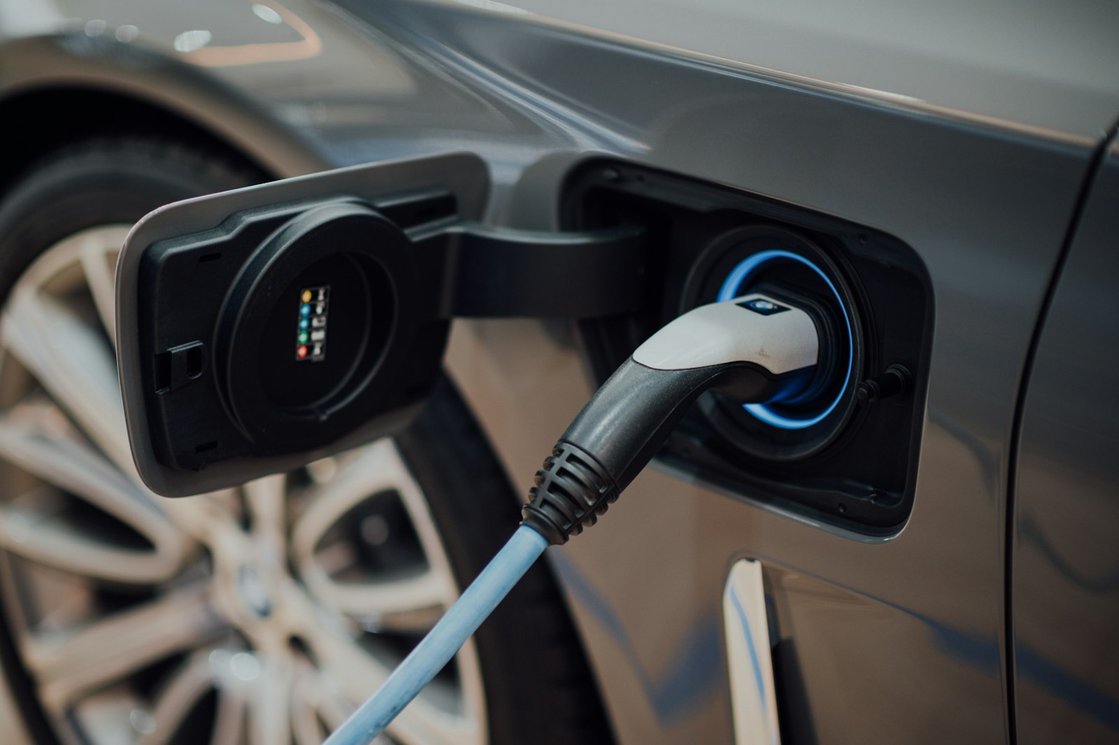 An electric vehicle charging in Pennsylvania, subject to the annual road user charge